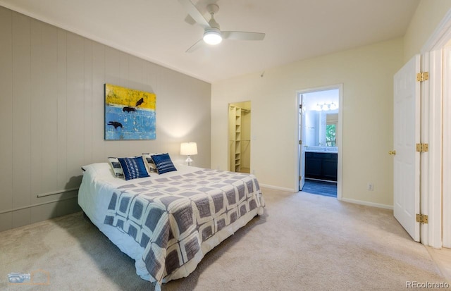 2428 W 82nd Pl Unit 3G, Westminster, CO 80031 - bedroom featuring light colored carpet, ceiling fan, a spacious closet, and ensuite bathroom
