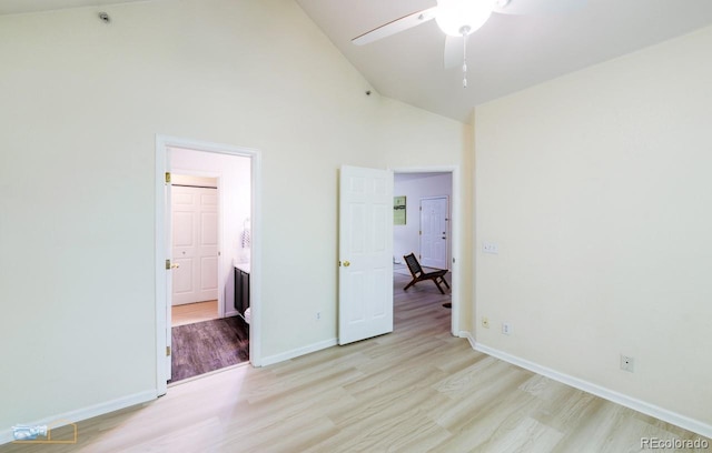 2428 W 82nd Pl Unit 3G, Westminster, CO 80031 - unfurnished bedroom with high vaulted ceiling, light wood-type flooring, and ensuite bathroom