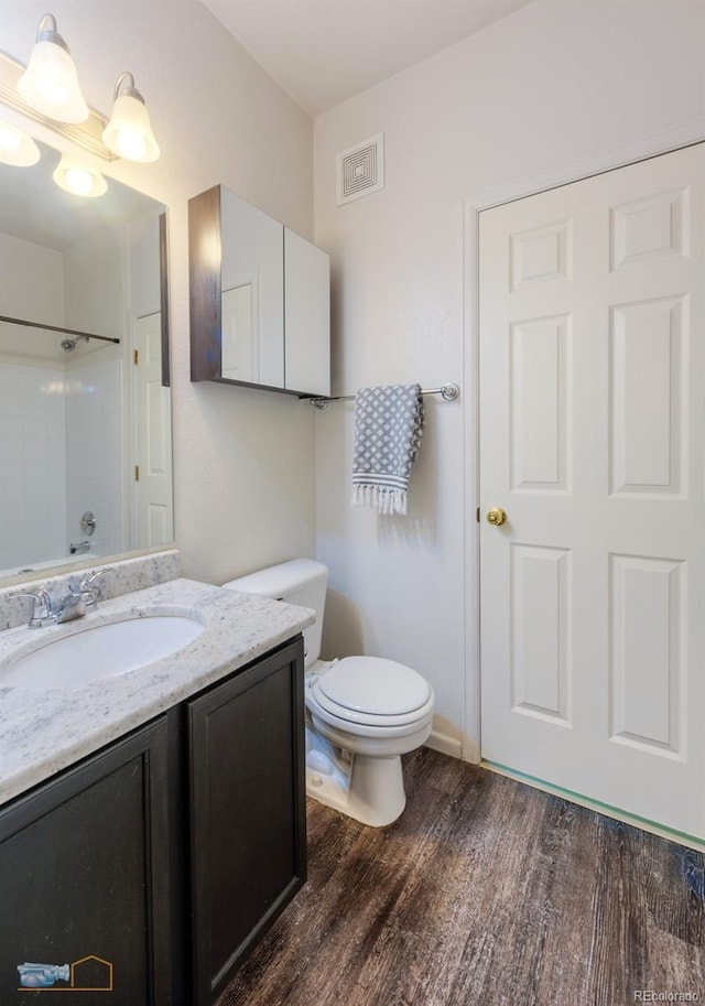 2428 W 82nd Pl Unit 3G, Westminster, CO 80031 - bathroom featuring vanity, wood finished floors, and a shower