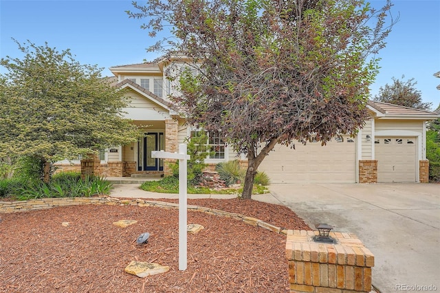 22019 E Arbor Dr, Aurora, CO 80016 - view of property hidden behind natural elements with concrete driveway, a garage, and brick siding