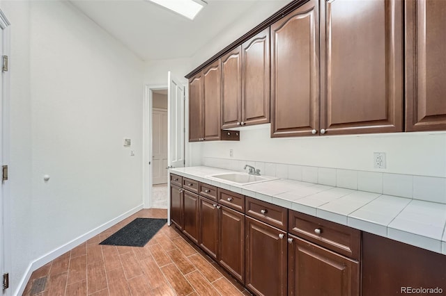 22019 E Arbor Dr, Aurora, CO 80016 - kitchen featuring tile counters and dark brown cabinets