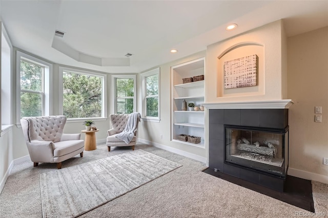 22019 E Arbor Dr, Aurora, CO 80016 - sitting room with carpet, built in features, a tile fireplace, and recessed lighting