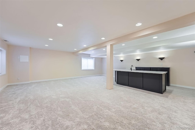 22019 E Arbor Dr, Aurora, CO 80016 - below grade area with wet bar, light carpet, and recessed lighting