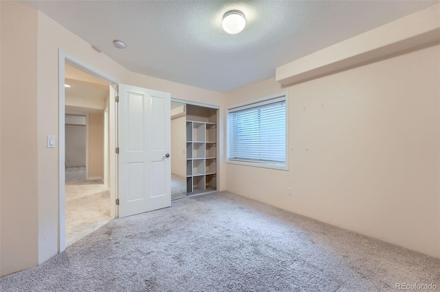22019 E Arbor Dr, Aurora, CO 80016 - unfurnished bedroom featuring carpet floors and a textured ceiling