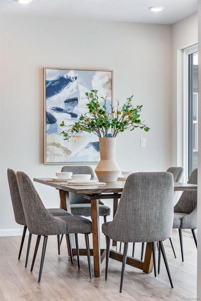 dining area with light hardwood / wood-style flooring