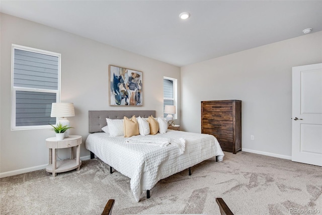 bedroom featuring light carpet