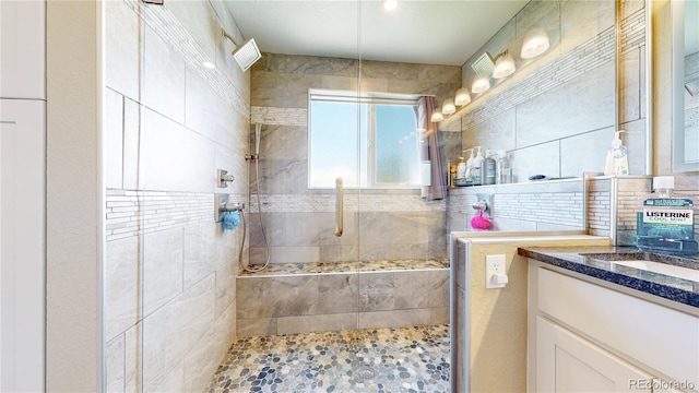 14833 Vine St, Thornton, CO 80602 - full bath with tiled shower, vanity, and decorative backsplash