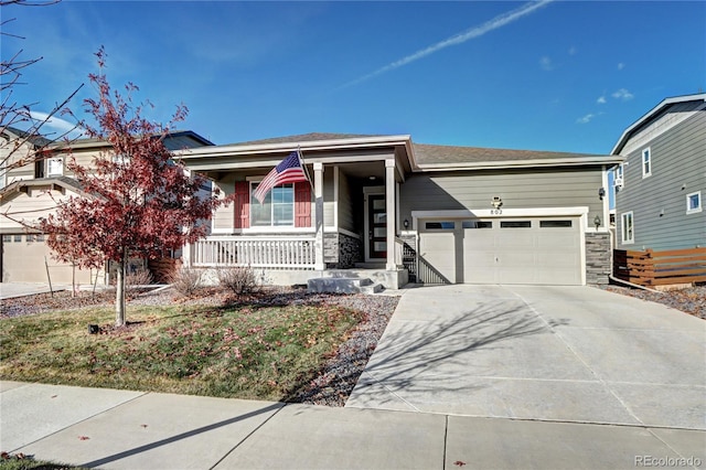 view of front of house featuring a porch and a garage