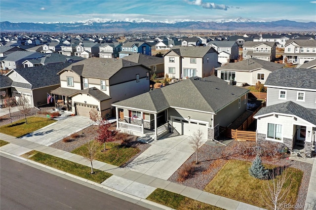 bird's eye view with a residential view and a mountain view