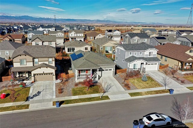 birds eye view of property featuring a mountain view and a residential view