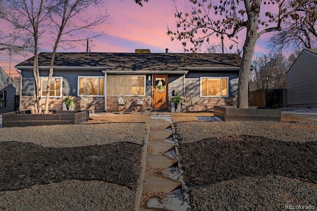 view of back house at dusk