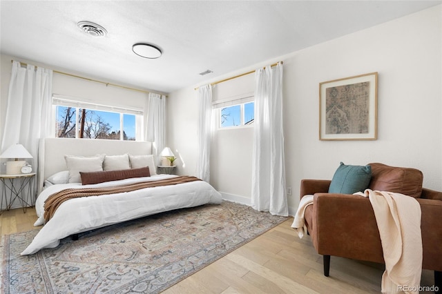 bedroom with light hardwood / wood-style flooring