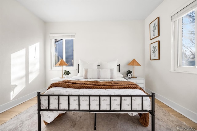 bedroom with light hardwood / wood-style floors