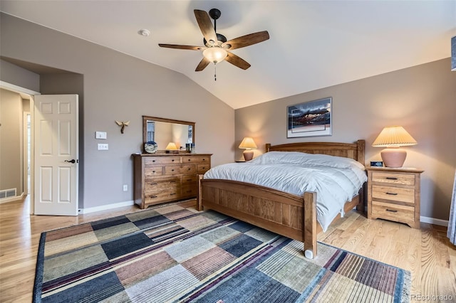 bedroom featuring lofted ceiling, ceiling fan, light wood-type flooring, baseboards, and visible vents