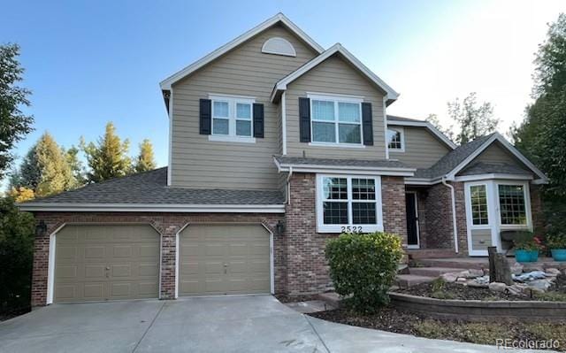 view of front of property featuring concrete driveway, brick siding, and roof with shingles