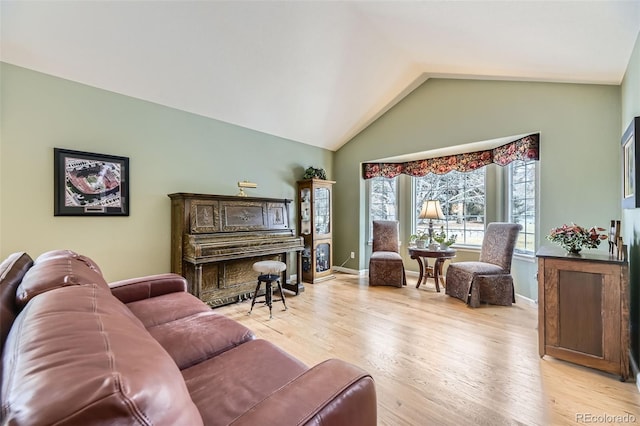2522 W Dry Creek Ct, Littleton, CO 80120 - living room with lofted ceiling, wood finished floors, and baseboards