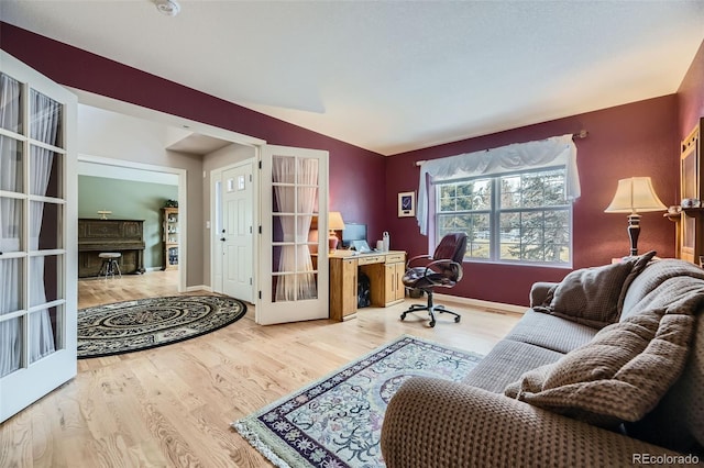 2522 W Dry Creek Ct, Littleton, CO 80120 - office space featuring wood finished floors, vaulted ceiling, french doors, and baseboards