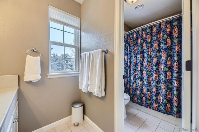 2522 W Dry Creek Ct, Littleton, CO 80120 - bathroom featuring tile patterned flooring, toilet, baseboards, a shower with shower curtain, and vanity