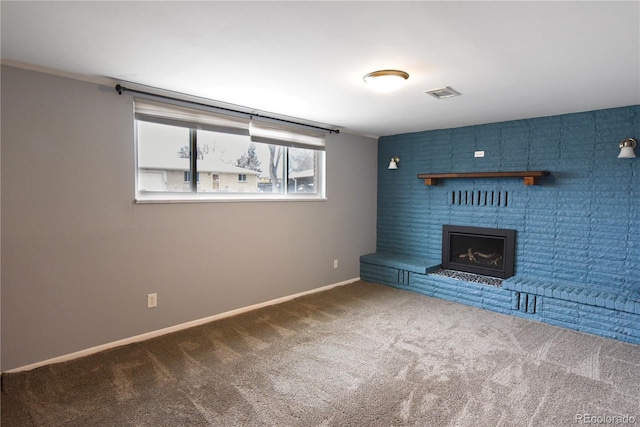 unfurnished living room featuring a fireplace and carpet floors