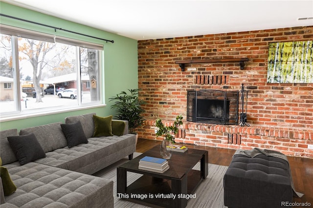 5063 W 61st Ave, Arvada, CO 80003 - living area with wood finished floors and a brick fireplace