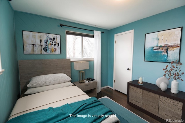 5063 W 61st Ave, Arvada, CO 80003 - bedroom featuring dark wood finished floors and baseboards