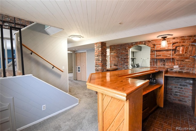 5063 W 61st Ave, Arvada, CO 80003 - indoor bar featuring wood ceiling, stairway, and brick wall