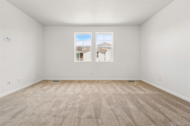 3401 N Denali St, Aurora, CO 80019 - carpeted spare room featuring baseboards