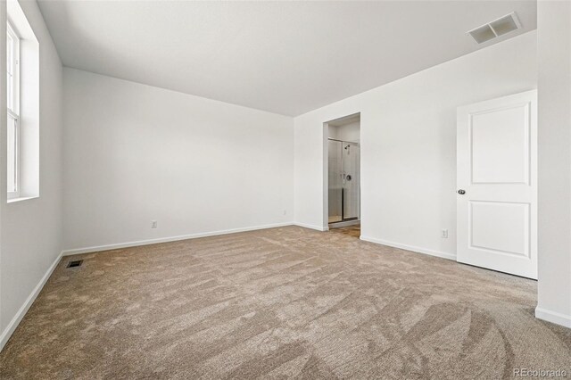 3401 N Denali St, Aurora, CO 80019 - unfurnished bedroom featuring carpet floors, baseboards, and ensuite bathroom