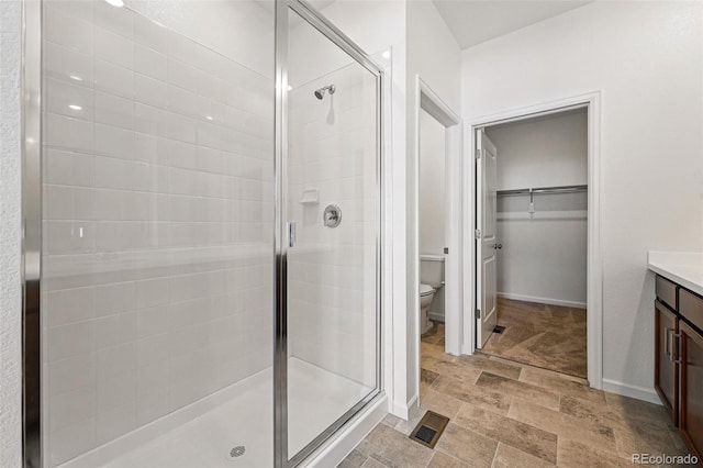 3401 N Denali St, Aurora, CO 80019 - full bath featuring a shower stall, toilet, vanity, and a spacious closet