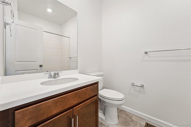 3401 N Denali St, Aurora, CO 80019 - bathroom featuring vanity, baseboards, toilet, a shower, and tile patterned flooring