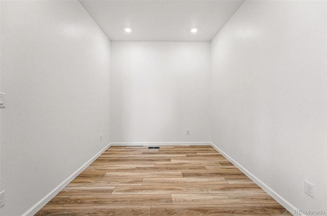3401 N Denali St, Aurora, CO 80019 - empty room with light wood-type flooring, recessed lighting, and baseboards
