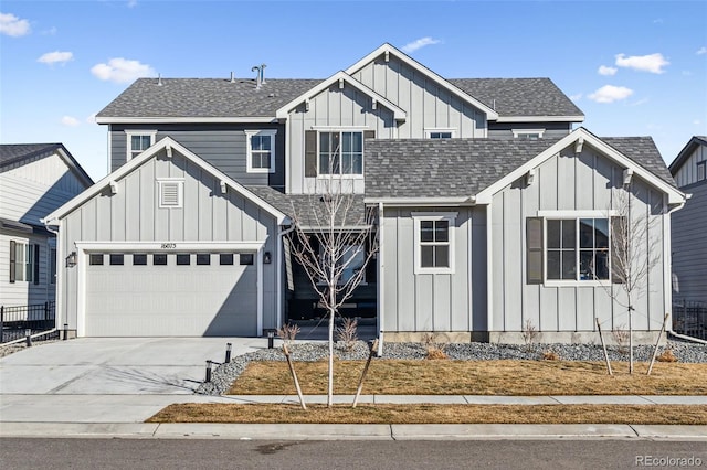 view of front of property featuring driveway, a shingled roof, and board and batten siding