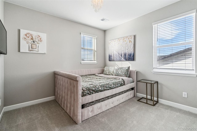 bedroom featuring carpet, visible vents, and baseboards