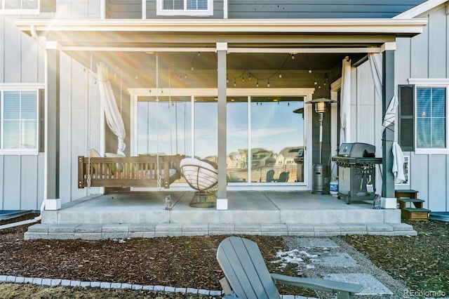 property entrance featuring board and batten siding