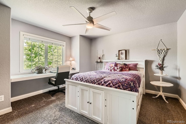 14118 Whitney Cir, Broomfield, CO 80023 - bedroom with dark colored carpet, a desk, a textured ceiling, and a ceiling fan