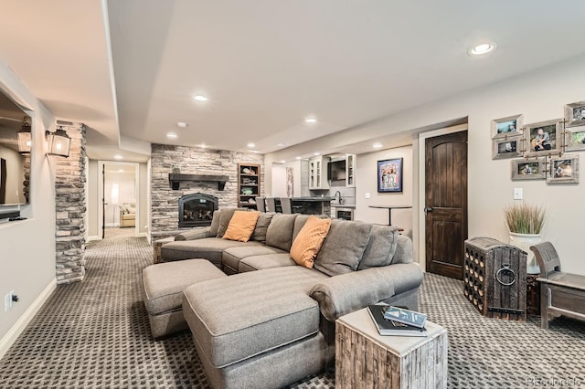14118 Whitney Cir, Broomfield, CO 80023 - living room with carpet, a stone fireplace, recessed lighting, bar area, and decorative columns
