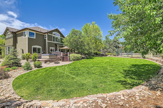 14118 Whitney Cir, Broomfield, CO 80023 - view of grassy yard featuring a hot tub and a wooden deck