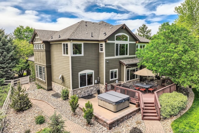 14118 Whitney Cir, Broomfield, CO 80023 - back of house with roof with shingles, a deck, stone siding, and outdoor dining area