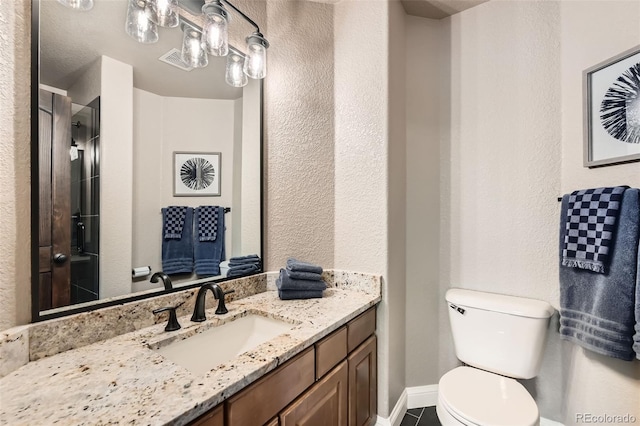 14118 Whitney Cir, Broomfield, CO 80023 - full bathroom with vanity, tile patterned flooring, a shower with shower door, and a textured wall
