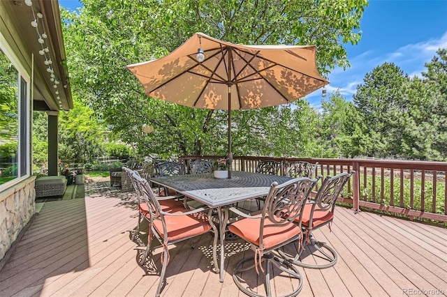 14118 Whitney Cir, Broomfield, CO 80023 - deck with outdoor dining space and view of wooded area