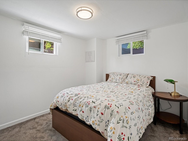 bedroom featuring carpet flooring and baseboards