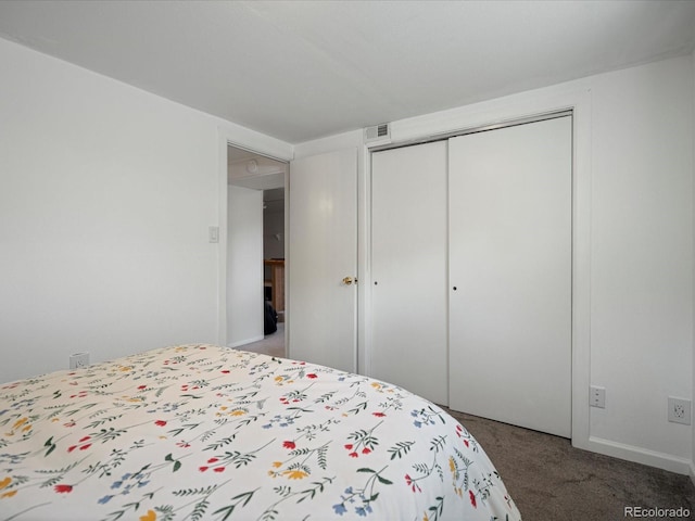 carpeted bedroom featuring a closet