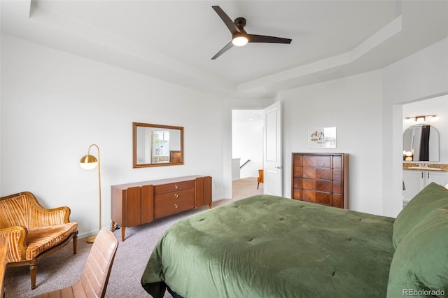 9567 Juniper Way, Arvada, CO 80007 - bedroom with light carpet, a raised ceiling, ensuite bath, and a ceiling fan