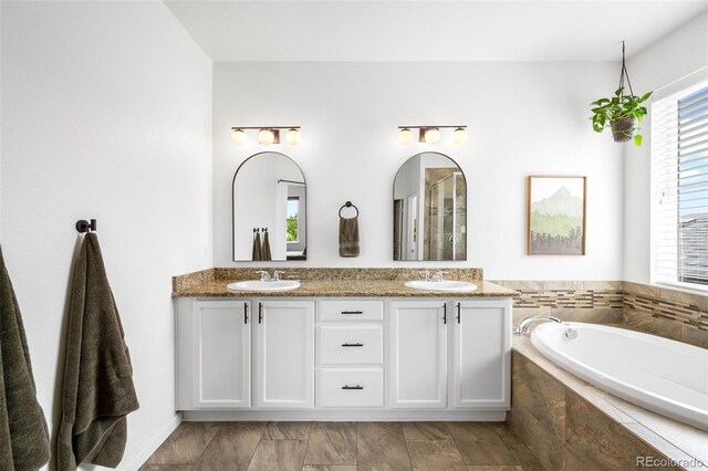 9567 Juniper Way, Arvada, CO 80007 - full bath with double vanity and a garden tub