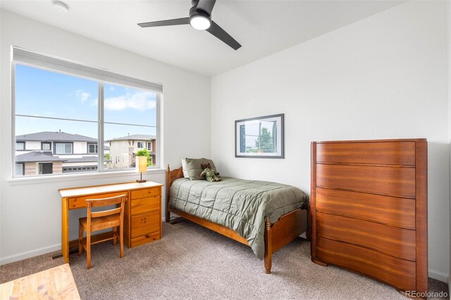 9567 Juniper Way, Arvada, CO 80007 - carpeted bedroom with ceiling fan and baseboards