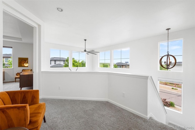 9567 Juniper Way, Arvada, CO 80007 - unfurnished room with a chandelier, carpet, healthy amount of natural light, and baseboards