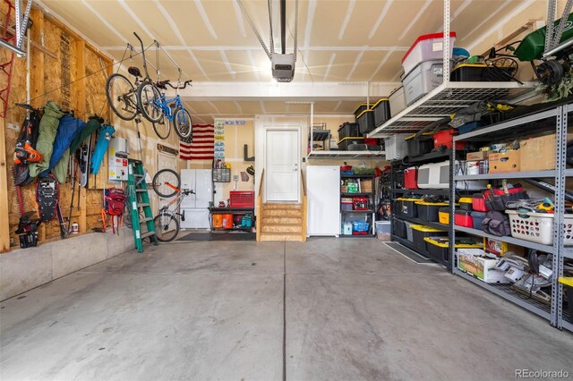 9567 Juniper Way, Arvada, CO 80007 - garage with a garage door opener