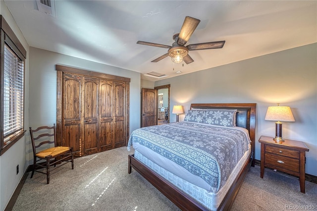 bedroom featuring attic access, carpet, visible vents, and baseboards