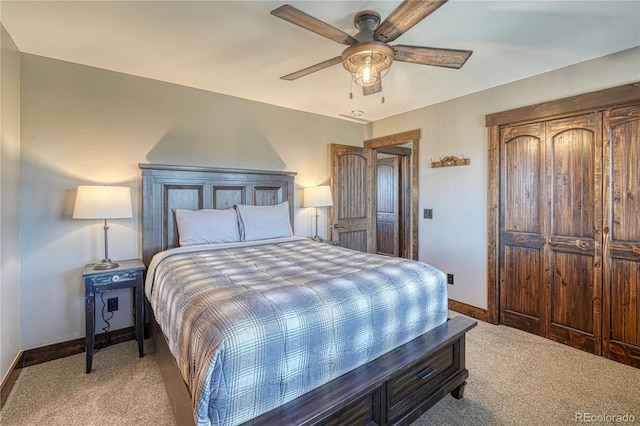 bedroom with light carpet, ceiling fan, and baseboards