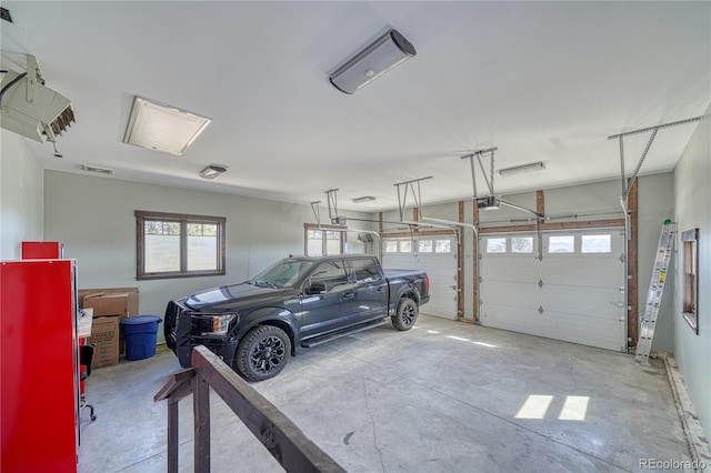 garage with visible vents and a garage door opener